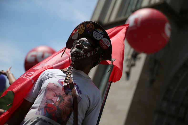 A demonstrator attends a protest against Brazil's President Jair Bolsonaro's proposal to reform the social security system.