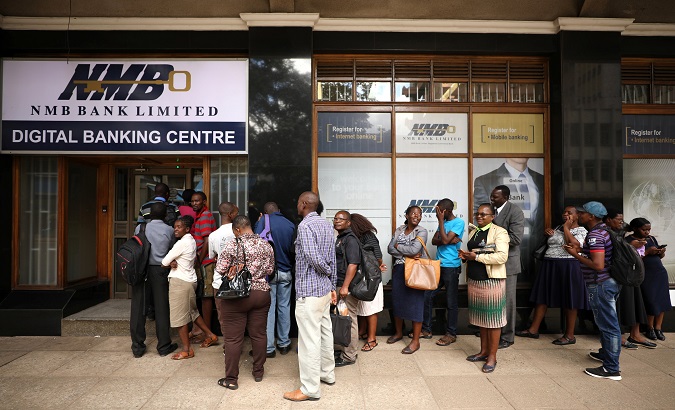 People queue outside a bank in Harare, Zimbabwe February 22, 2019.