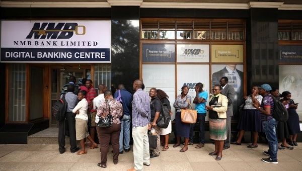 People queue outside a bank in Harare, Zimbabwe February 22, 2019.