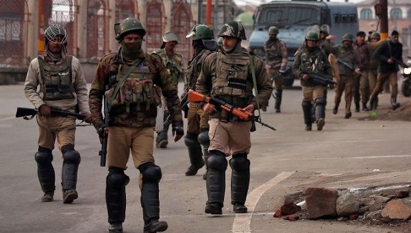 Indian Central Reserve Police Force (CRPF) personnel patrol a street in downtown Srinagar Feb. 23, 2019.
