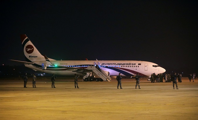 Security personnel stand guard outside of the hijacked aircraft of the Biman Bangladesh Airlines in the Shah Amanat International Airport in Chattogram, Bangladesh February 24, 2019.