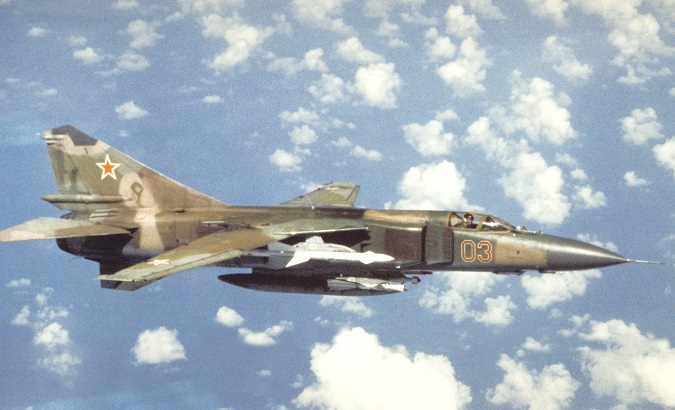 An air-to-air right side view of a Soviet MiG-23 Flogger aircraft