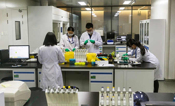 Chinese scientists work in the DNA research laboratory for gene sequencing, in Nanjing, China, Nov. 13, 2018.