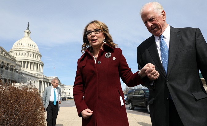 U.S. Representative Mike Thompson (D-CA), joined by shooting survivor and former Representative Gabby Giffords (D-AZ), arrives for a news conference about his proposed gun background check legislation.