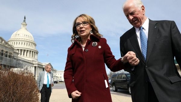 U.S. Representative Mike Thompson (D-CA), joined by shooting survivor and former Representative Gabby Giffords (D-AZ), arrives for a news conference about his proposed gun background check legislation.