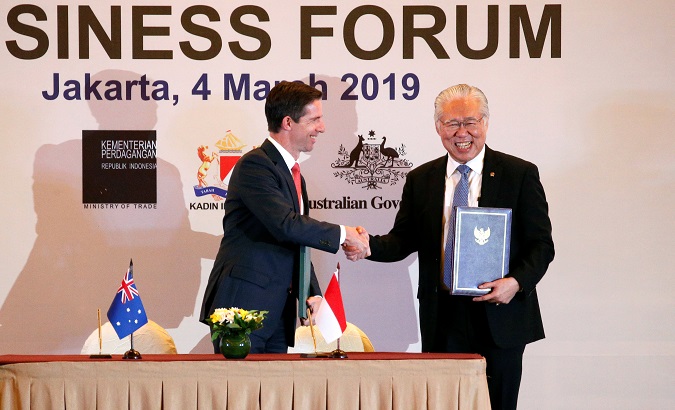 Indonesia's Trade Minister Enggartiasto Lukita and Australia's Minister of Trade, Tourism and Investment Simon Birmingham shakes hands after signing an economic partnership agreement aimed at boosting trade and investment in Jakarta, Indonesia, March 4, 2019.