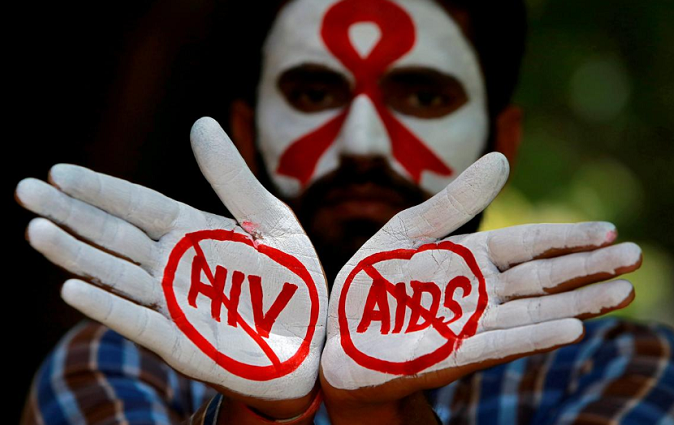 An activist during an HIV/AIDS awareness campaign to mark the International AIDS Candlelight Memorial, in Chandigarh, India, May 20, 2018.