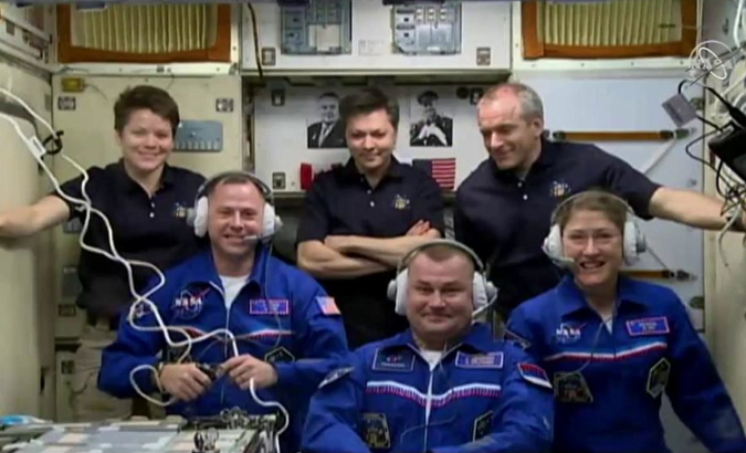 Three space travelers opened the hatch to their new home on the International Space Station.