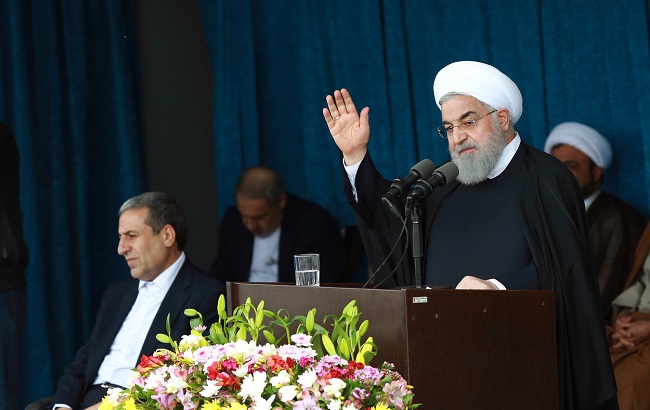 Iranian President Hassan Rouhani gestures to the crowd at a public speech in Bandar Kangan, Iran March 17, 2019.