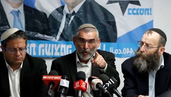 Michael Ben-Ari from the Jewish Power party delivers a statement to the media together with his party's members, Baruch Marzel and Itamar Ben-Gvir, March 17, 2019. 