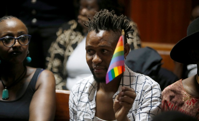 An LGBT activist displays the rainbow flag during a court hearing at the Milimani High Court in Nairobi, Kenya.
