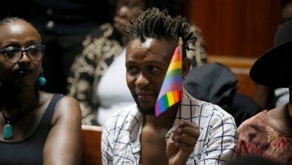 An LGBT activist displays the rainbow flag during a court hearing at the Milimani High Court in Nairobi, Kenya.