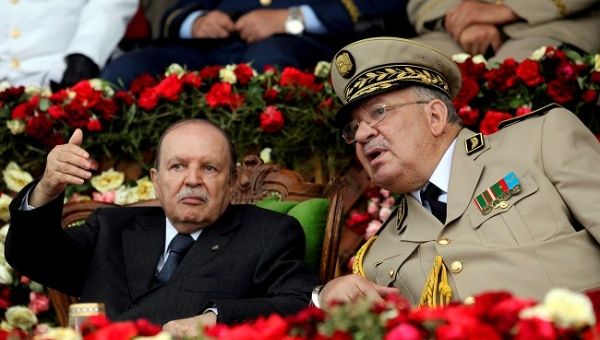 Algeria's President Abdelaziz Bouteflika gestures while talking with Army Chief of Staff General Ahmed Gaed Salah, Algeria June 27, 2012. 