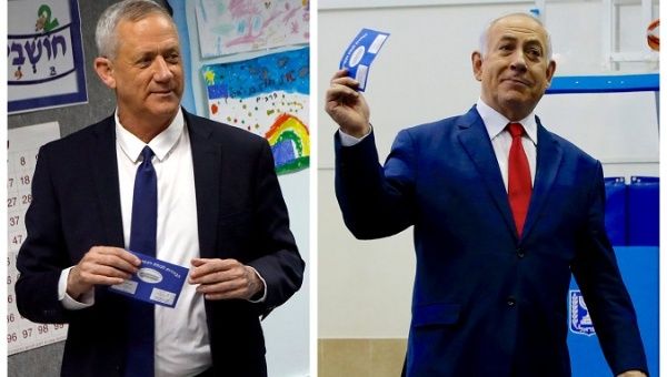 Benny Gantz (left), leader of Blue and White party and Israel’s Prime Minister Benjamin Netanyahu voting during Israel's parliamentary election April 9, 2019. 