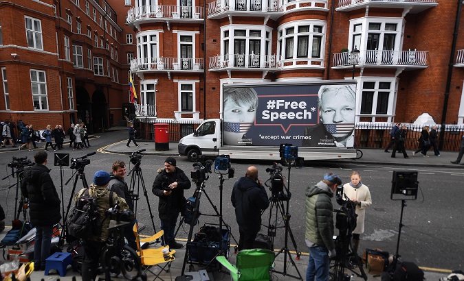 Journalists wait in front of the Ecuadorian Embassy in London, United Kingdom, April 11, 2019.