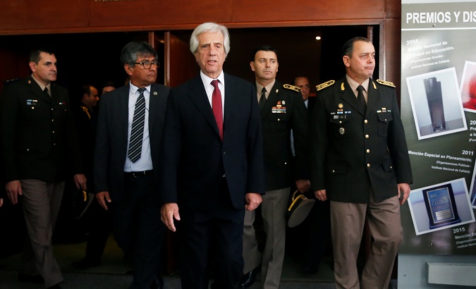 Uruguayan President Tabare Vazquez and General Claudio Feola walks after Feola's designation as new Commanding General of the Uruguayan Army in Montevideo, Uruguay April 8, 2019.
