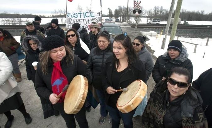 Protesting members of First Nation's bands form a blockade at the main VIA rail line between Toronto and Ottawa near Marysville, Ontario March 19, 2014.