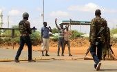 Security officers question civilians near the scene where gunmen abducted two Cuban doctors in Mandera county, Kenya, April 12, 2019.
