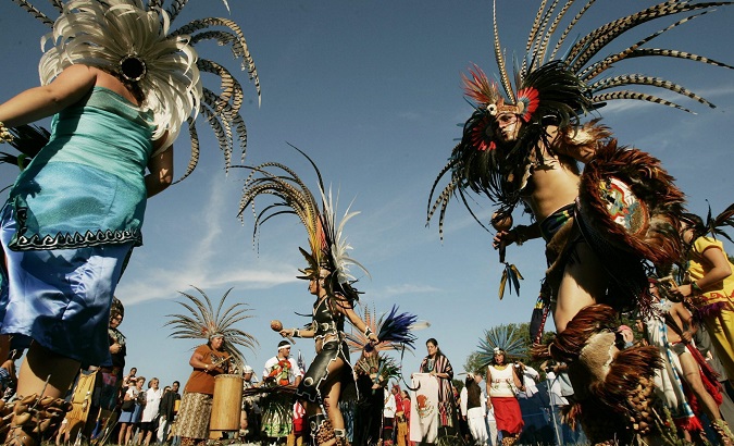 Native Americans participate in the Parade of Nations.