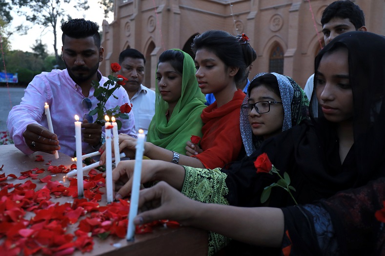 People light candles for the victims of Sri Lanka's serial bomb blasts, outside a church in Peshawar, Pakistan April 21, 2019