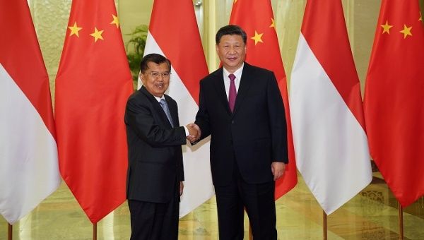 President Xi Jinping shakes hands with Indonesia's Vice President Jusuf Kalla at the Great Hall of the People, in Beijing, China, April 25, 2019.