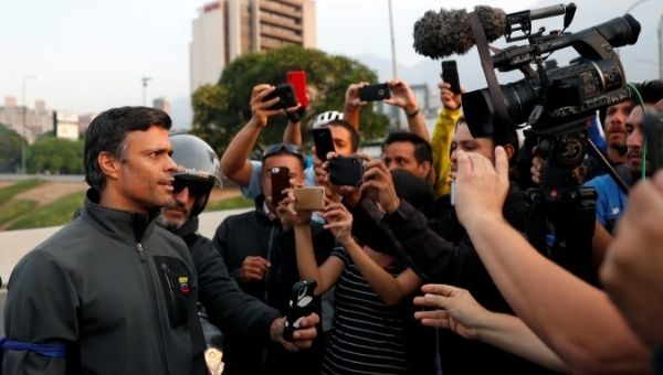 Venezuelan opposition leader Leopoldo Lopez talks to the media after violating his house arrest.