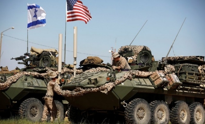U.S. Marine sits on top of an armored personnel carrier during Juniper Cobra, a U.S.-Israel joint air defence exercise in southern Israel, March 12, 2018.