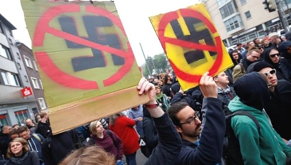 Anti-fascists protest against a march of far-right supporters of the party Die Rechte during a May Day rally through the streets of Duisburg, Germany