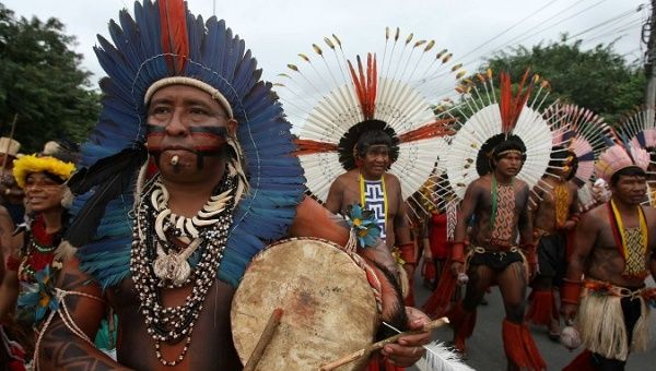 Brazilian Indigenouspeople march together during a demonstration in Rio de Janeiro.