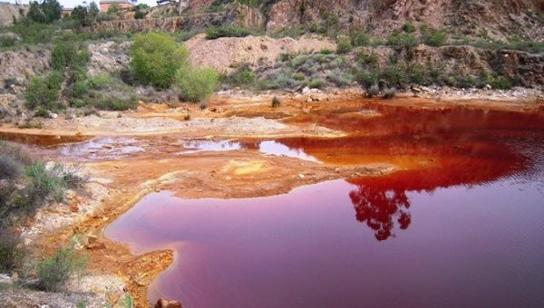 A body of water contaminated by acid due to mining.