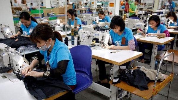 Labourers work at export garment Maxport factory in Hanoi, Vietnam March 20, 2019. 