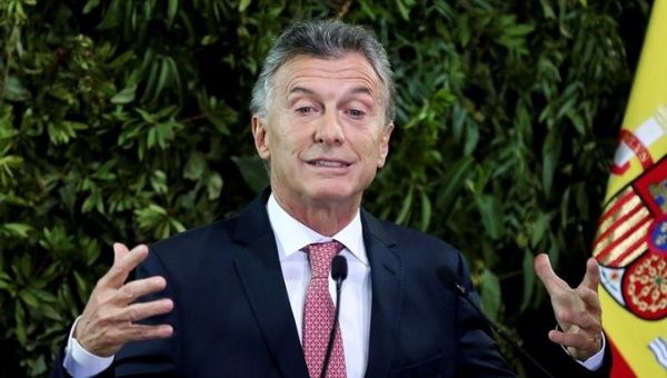 Argentina's President Mauricio Macri gestures as he gives a speech during a state dinner at the Centro Cultural Kirchner, in Buenos Aires, Argentina. March 25, 2019.