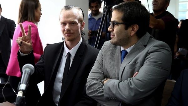 Swedish privacy rights activist Ola Bini (L) in an appeal hearing at a Provincial Court in Quito, Ecuador, May 2, 2019.