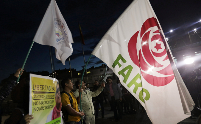 Revolutionary Alternative Force of the Common (FARC) Political party flags are seen during a protest in support of the release of former FARC leader Jesus Santrich, in Bogota, Colombia May 15, 2019