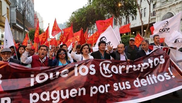 An anti-corrption march in Peru at which demonstrators held a sign reading, 
