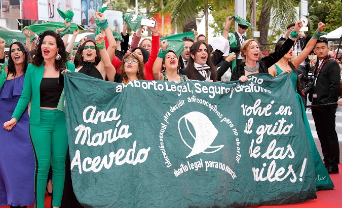 Argentine women with green handkerchiefs demonstrate against the rejection of the law legalizing abortion in their country, Cannes, France, May 18, 2019.
