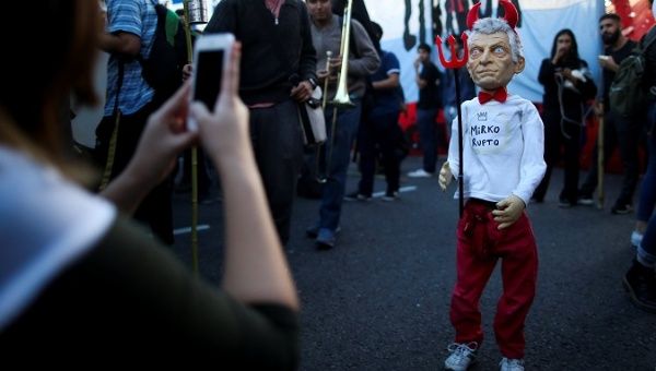 President Mauricio Macri as an IMF puppet during a teacher's protest in Buenos Aires, Argentina May 16, 2019.