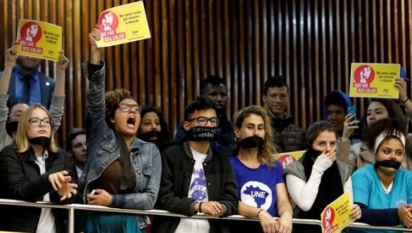 Students protest against President Jair Bolsonaro's policies at the legislative Assembly in Curitiba, Brazil, May 28, 2019. The sign reads, 