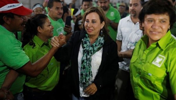 Sandra Torres, presidential candidate for the National Unity of Hope (UNE), greets to supporters during a rally, in Guatemala City