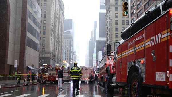 New York City Fire Department trucks and firefighters outside 787 7th Avenue in midtown Manhattan where helicopter crashed in New York.