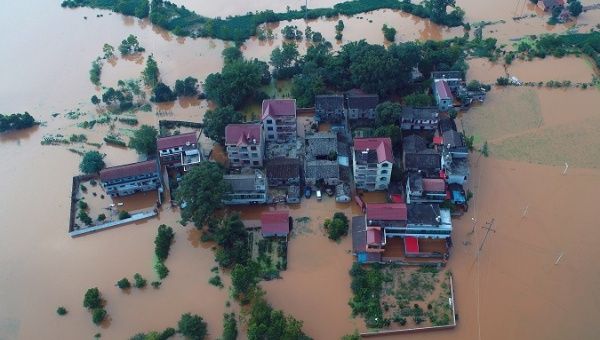 Residential houses and cars are seen submerged in floodwaters following heavy rainfall in Taihe county, Jian, Jiangxi province, China June 10, 2019.