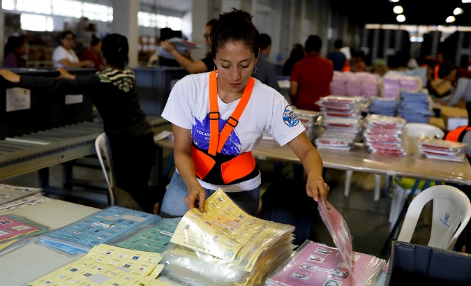 An employee arranges ballots at a warehouse before Sunday's 1st-round general election, in Guatemala City, Guatemala June 11, 2019.