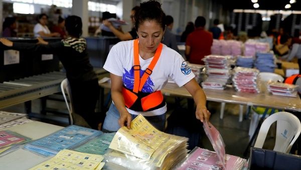 An employee arranges ballots at a warehouse before Sunday's 1st-round general election, in Guatemala City, Guatemala June 11, 2019. 
