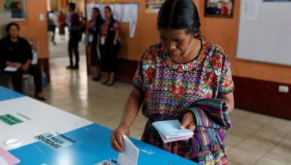 A woman votes at a polling station during the first round of Guatemala's presidential election, in San Pedro Sacatepequez, Guatemala, June 16, 2019.
