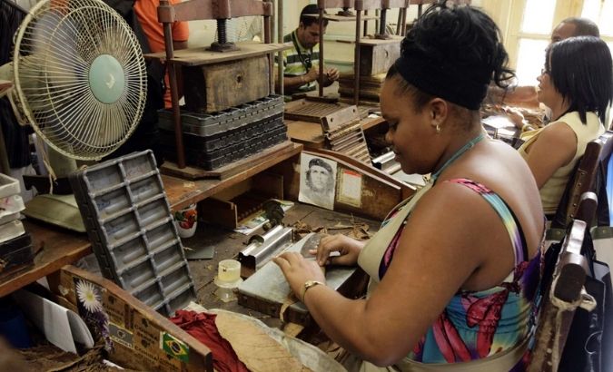 A worker rolls cigars at the Cohiba factory in Havana