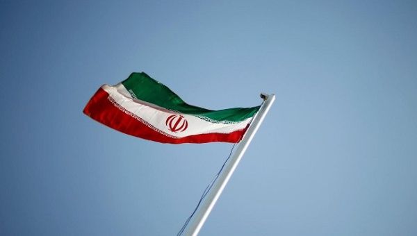 An Iranian national flag flutters during the opening ceremony of the 16th International Oil, Gas & Petrochemical Exhibition (IOGPE) in Tehran April 15, 2011.
