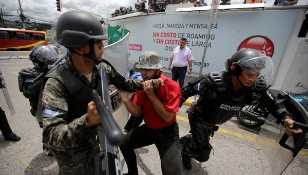 A demonstrator is detained during a protest against government's plans to privatize healthcare and education in Tegucigalpa, Honduras June 12, 2019