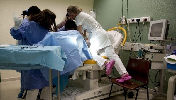 Doctors and nurses during a labor at the Leiria Hospital in Leiria, Portugal, April 7, 2014.