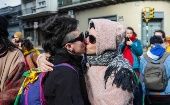 Two women protest by kissing in front of the Argentine Embassy in Montevideo, Uruguay, July 3, 2019.