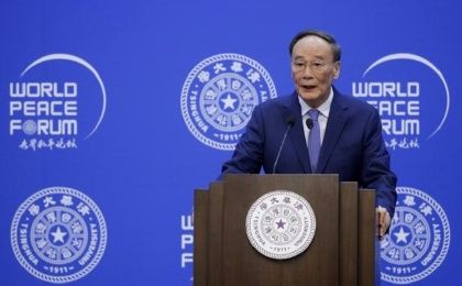 Chinese Vice President Wang Qishan delivers a speech at the opening of World Peace Forum at Tsinghua University, in Beijing, China, July 8, 2019